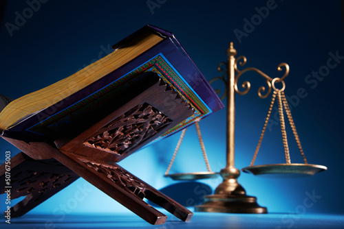sharia law concept , gavel hammer libra scale and holly koran photo