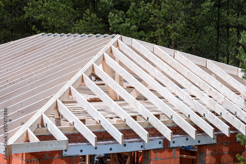 Wallpaper Mural Construction of a cottage. Rafters, logs of the roof of the house Torontodigital.ca