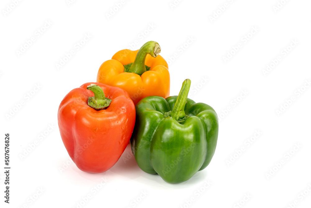 Capsicum - Bell Pepper green, red, orange, yellow isolated in plain extendable background, macro detailing, studio lighting, with ample copy space all around. Capsicum - Bell Pepper green, red, orange, yellow isolated in plain extendable background, macro detailing, studio lighting, with ample copy space all around.