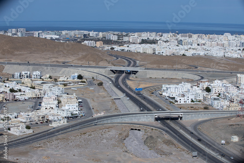 Muscat Oman city landscape and buildings with sea background photo