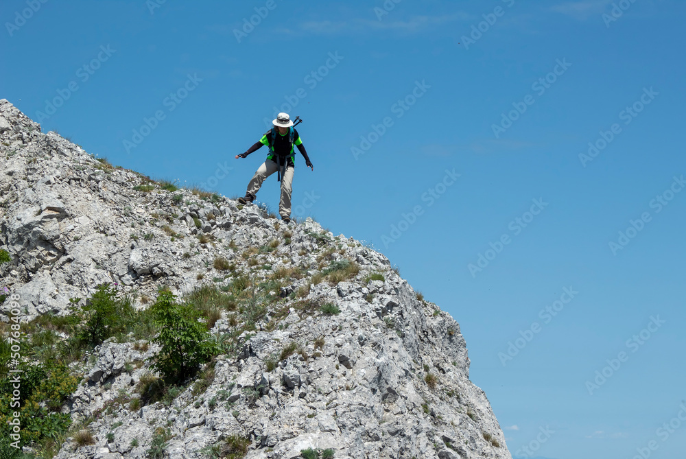 climber on the top of mountain climber on the top of mountain