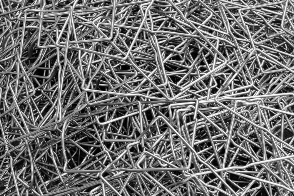 Metal texture background made of many bent steel wires, Close-up, industrial metalworking concept Metal texture background made of many bent steel wires, Close-up, industrial metalworking concept