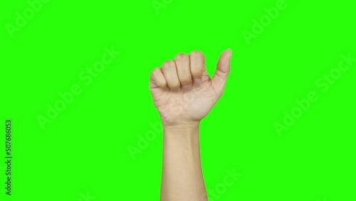 hand wrist knocking fist on green background photo