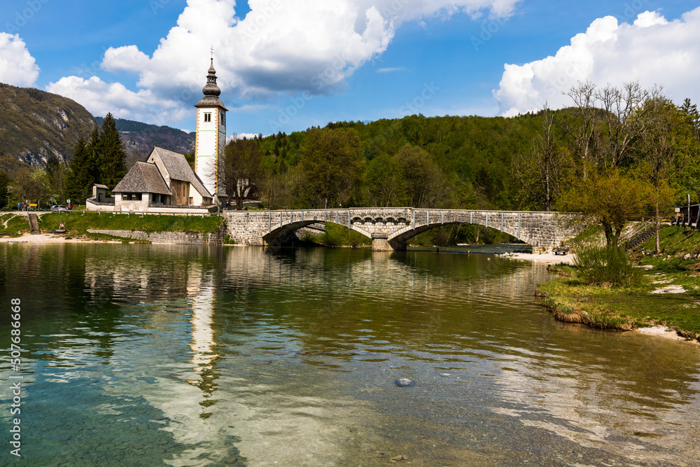 the church is located at the bridge on the lake
Bohnij, Slovenia