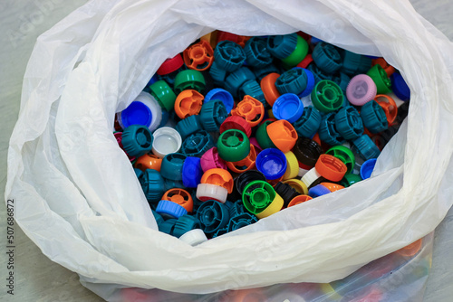 plastic bottle caps of baby food packages in a bag