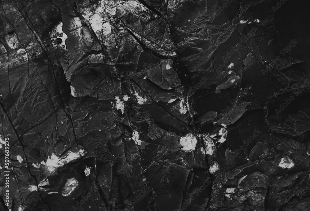 Dark marble. Black texture. Stone background. Rock texture. Rock surface with cracks. Rock pile. Paint spots wall. Grunge Rough structure. Abstract texture. Dark marble. Black texture. Stone background. Rock texture. Rock surface with cracks. Rock pile. Paint spots wall. Grunge Rough structure. Abstract texture.