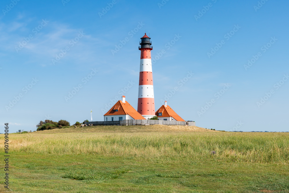 Westerheversand Lighthouse and Salzwiesen (salt marsh) in summer, Westerhever, Nordfriesland, Schleswig-Holstein, Germany Westerheversand Lighthouse and Salzwiesen (salt marsh) in summer, Westerhever, Nordfriesland, Schleswig-Holstein, Germany
