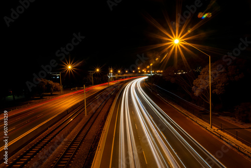 Light trails on a motorway at night, Perth, Western Australia, Australia photo
