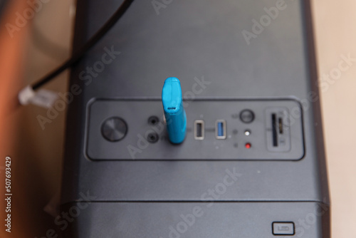 The flash drive electronic key is inserted into the system unit.