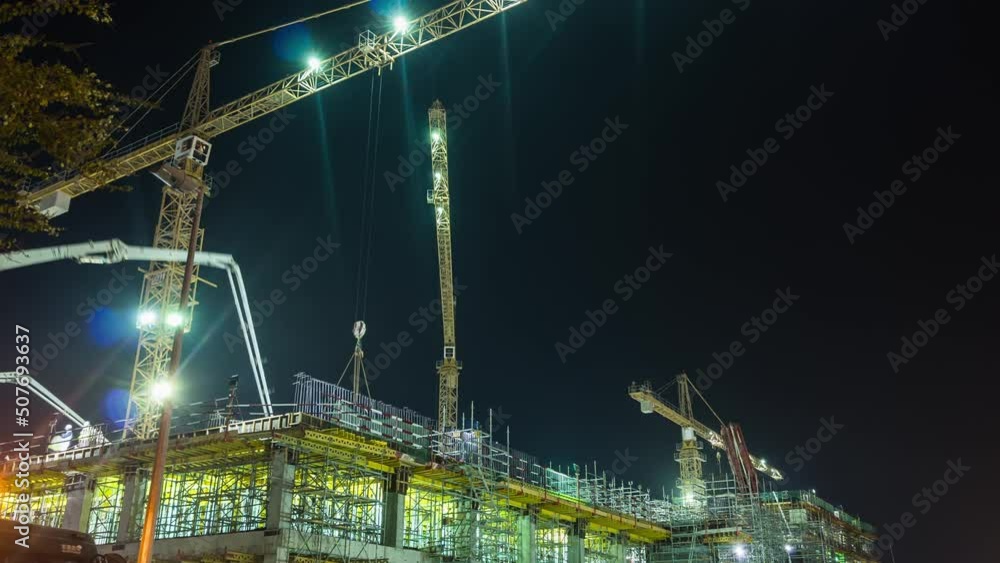 night illumination dubai city hotel construction working crane panorama 4k time lapse uae night illumination dubai city hotel construction working crane panorama 4k time lapse uae