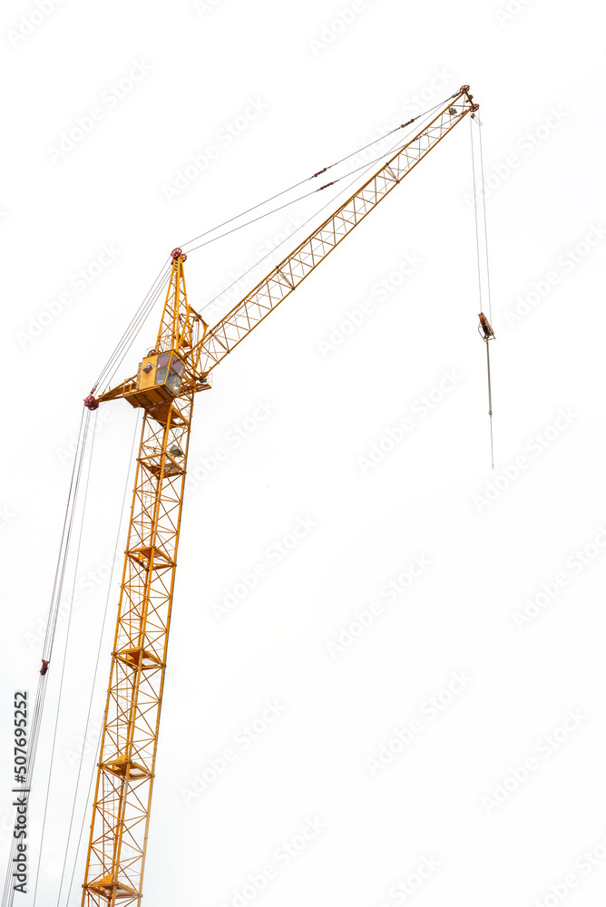 Construction of a residential building. Tower cranes building a new residential building. Unfinished panel house and construction crane