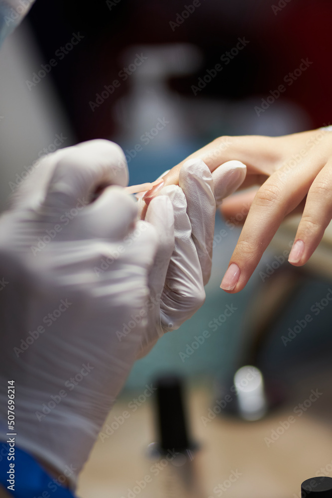 manicurist makes a manicure. The process of creating a quality manicure. Personal care. Beauty industry 
