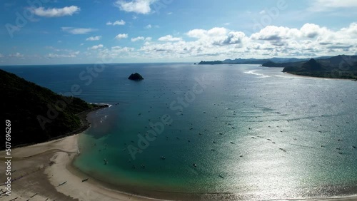 Aerial view of Selong Belanak, Tropical island with sandy beach and turquoise ocean with waves. Lombok. Indonesia