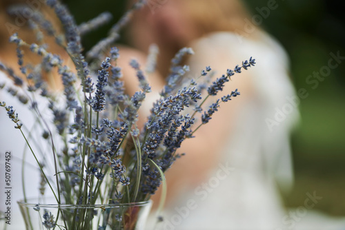 Lavender in a vase in nature. Lavender on a blurred background. Minimalistic, stylish, fashion concept