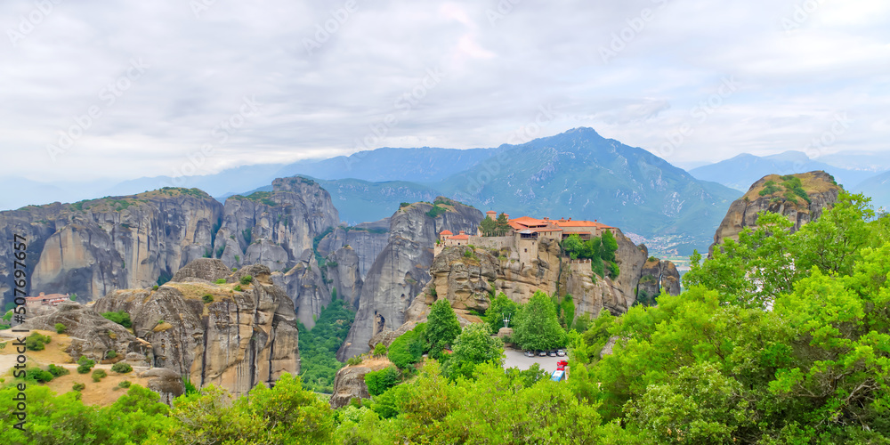 Stone monastery in the mountains. Kalabaka, Greece summer cloudy day in Meteora mountain valley. close up