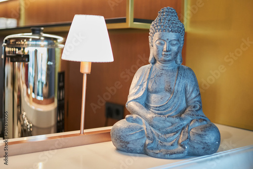 Buddha figurine on the bar of the restaurant  close-up