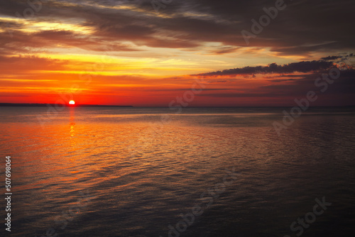 Dramatic sunset sky with clouds. Breathtaking sunset over the sea © es0lex