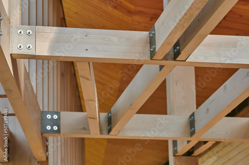 building from construction beams with metal brackets