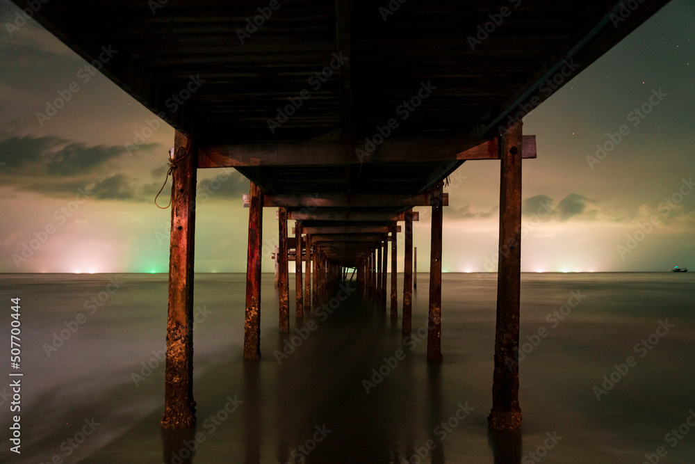 night shot of pier long exposure, Thailand. view under the pier night shot of pier long exposure, Thailand. view under the pier