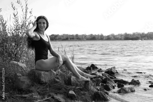 Beautiful woman in bikini at the river in black and white