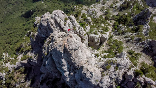  flight over the peak of ai petri mountain with red flag in Crimea.