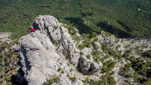  flight over the peak of ai petri mountain with red flag in Crimea.