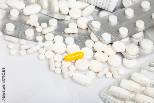Pills on white background, pharmaceutical industry concept