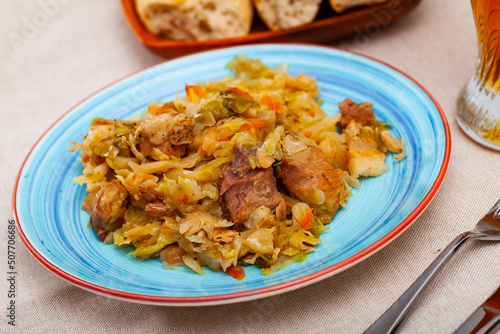 Portion of stewed cabbage with pork, healthy dinner