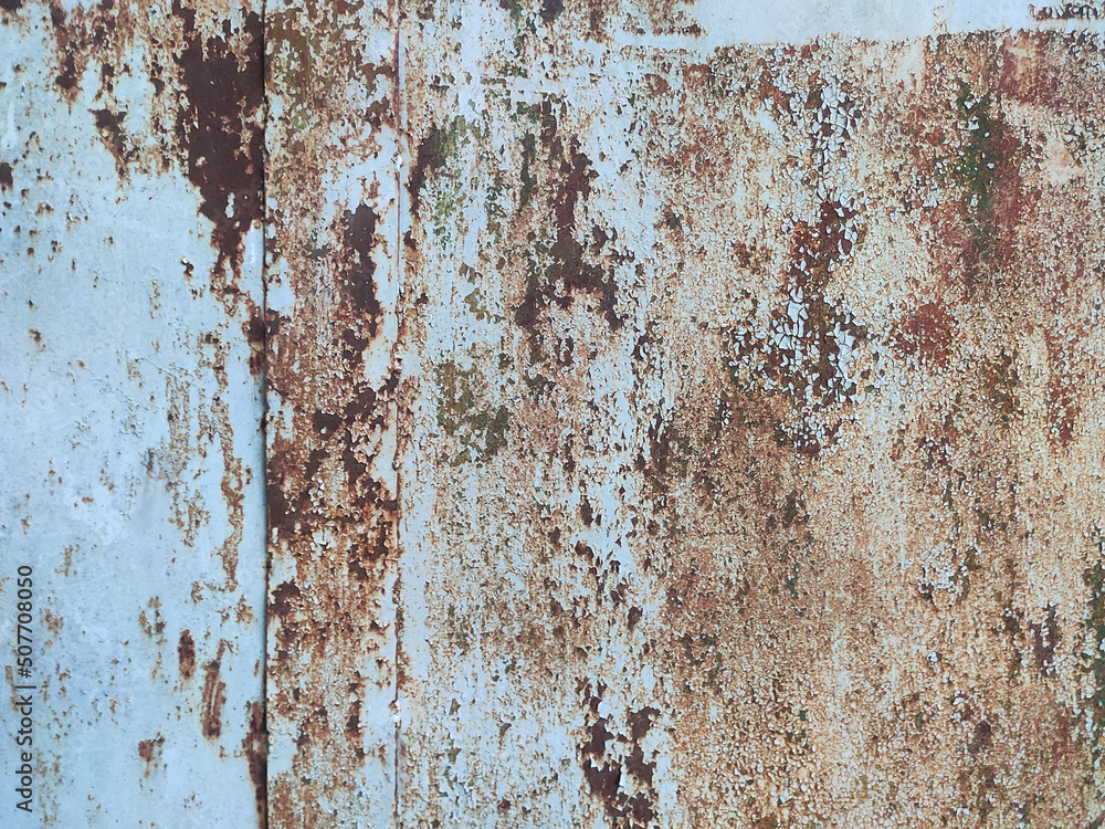 Corroded metal background. Rusty metal background with streaks of rust. Rust stains. Rystycorrosion.
