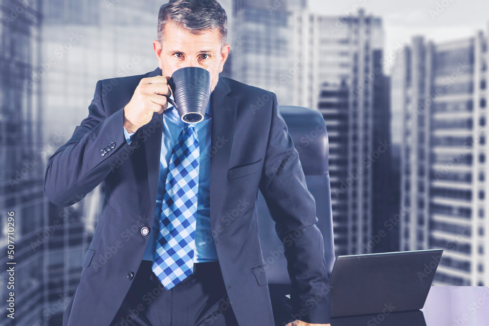 Male manager enjoying hot coffee in the office Male manager enjoying hot coffee in the office