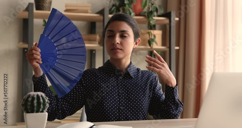 On too hot summer workday sweaty indian mixed race female waves handheld