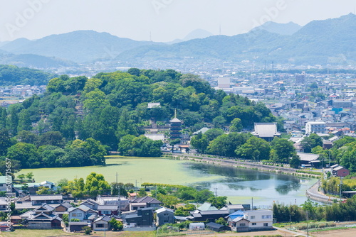 Landscape of a temple town and farm reservoir in Takamatsu city , Kagawa, Shikoku, Japan