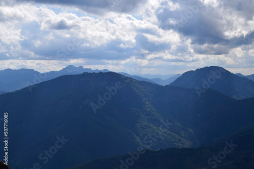 Beautiful endless mountain view with clouds and sunlight