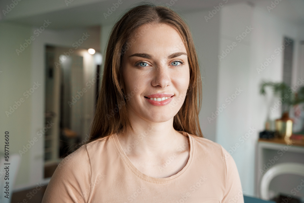 Portrait of smiling teenage woman college student looking at camera Portrait of smiling teenage woman college student looking at camera