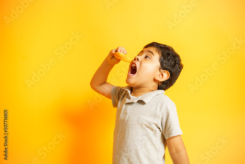child eating a pandebono