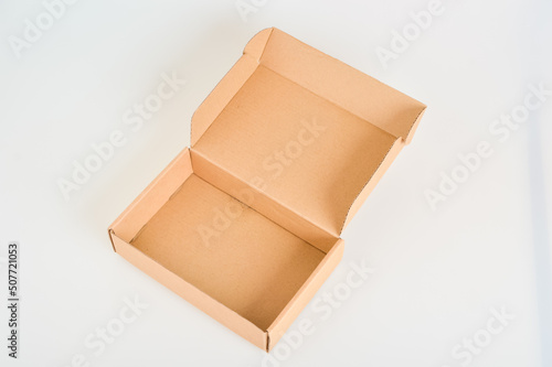 Brown cardboard box isolated on a white background © TeacherPhoto