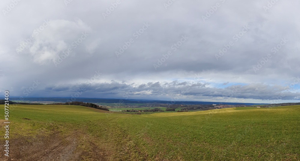 scenic panorama view of natural landscape under a cloudy sky