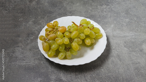 green grapes on a plate on the table