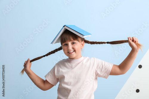 Little girl with braids and...