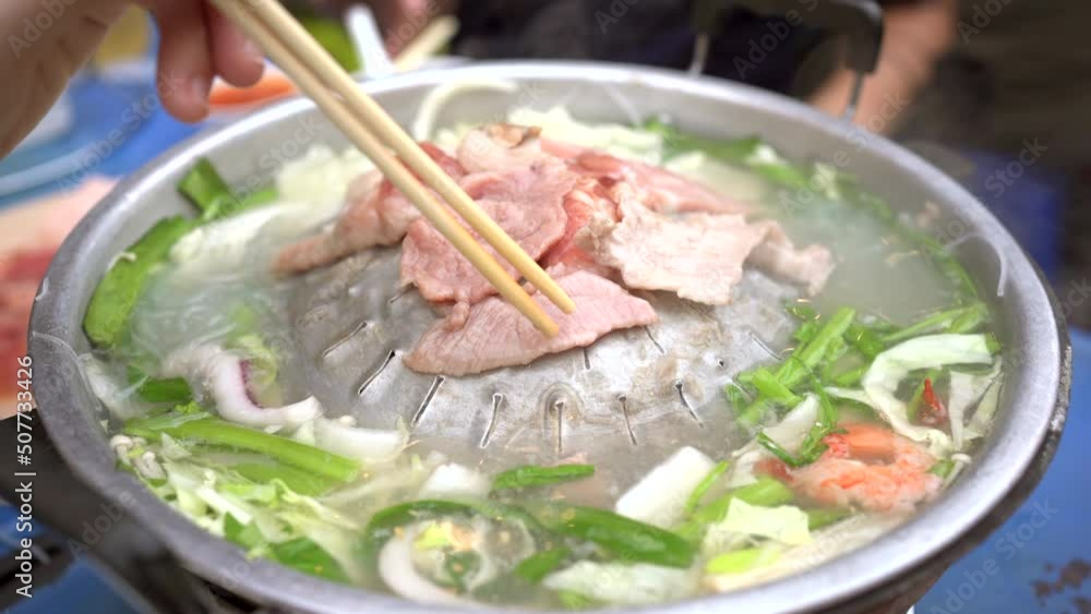 Asian people enjoy eating meat barbecue. Thai style BBQ called Moo Ka Ta. Asian people enjoy eating meat barbecue. Thai style BBQ called Moo Ka Ta.