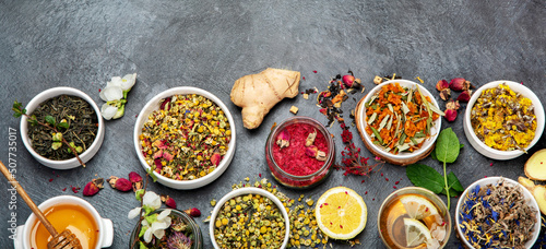 Herbal tea assortment on dark background.