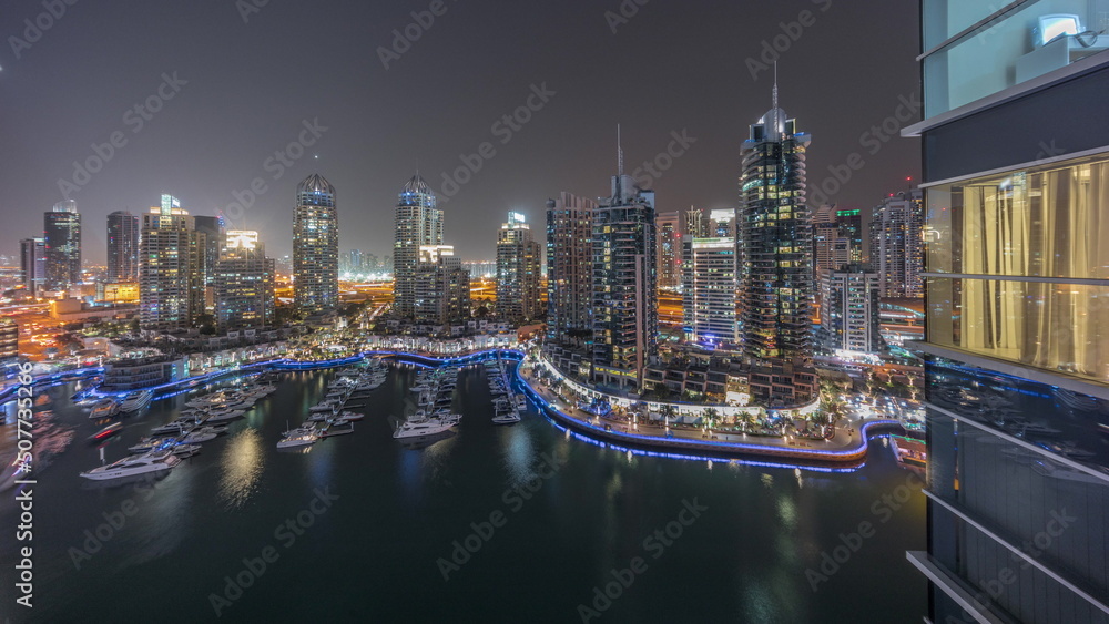 Luxury yacht bay in the city aerial night timelapse in Dubai marina Luxury yacht bay in the city aerial night timelapse in Dubai marina
