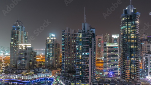 Photography Dubai Marina luxury tourist district with skyscrapers and towers around canal ae