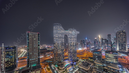 Futuristic Dubai Downtown and finansial district skyline aerial night timelapse. © neiezhmakov