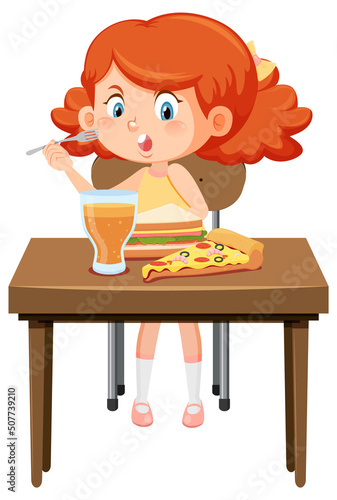 Happy girl enjoy eating food on table