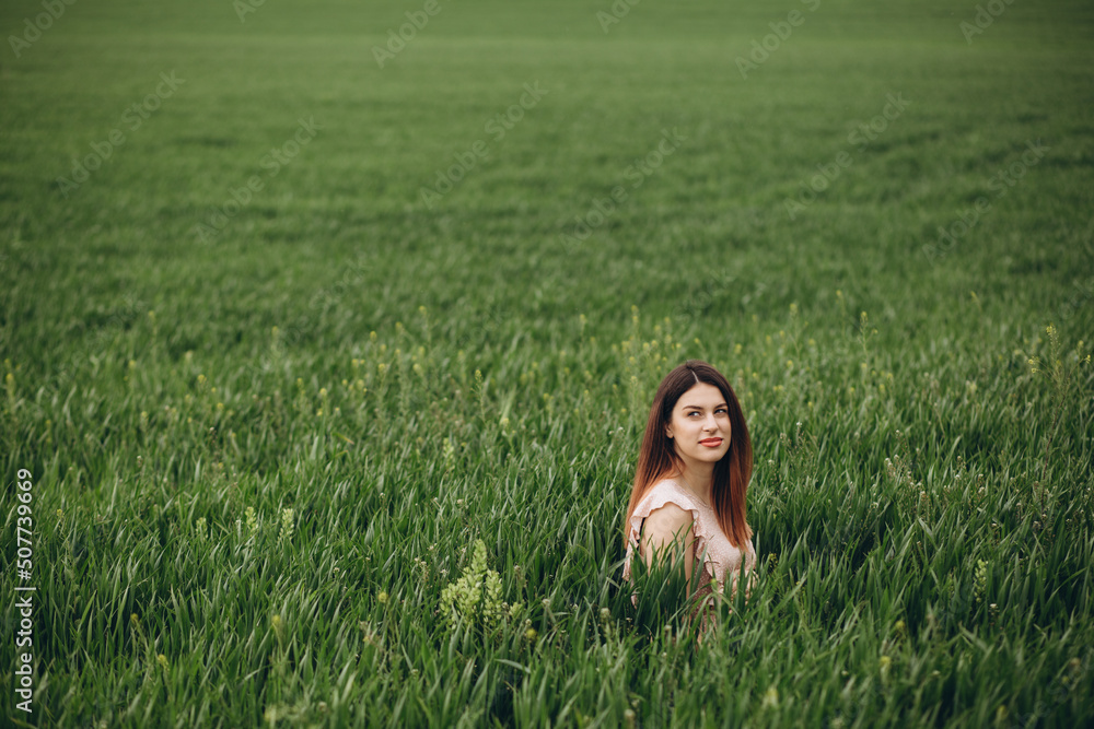 Happy girl face breathing fresh air and enjoying the sun in a meadow in a summer sunny day Happy girl face breathing fresh air and enjoying the sun in a meadow in a summer sunny day
