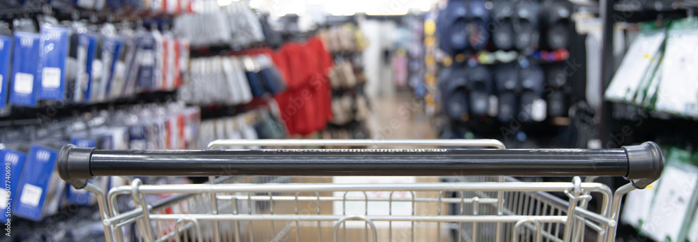 Shopping cart in supermarket, Abstract blurred photo in shopping malls, Cart in the market, wide variety of products are placed on the shelves for an orderly display. Shopping cart in supermarket, Abstract blurred photo in shopping malls, Cart in the market, wide variety of products are placed on the shelves for an orderly display.