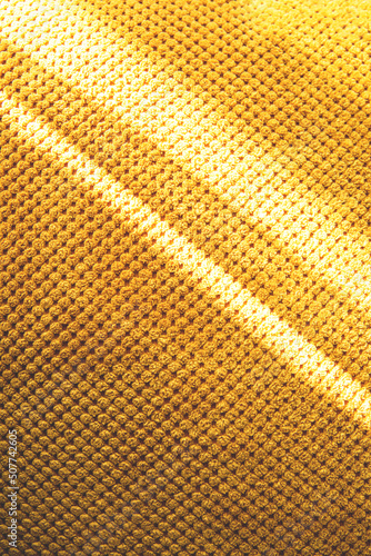 The texture of a yellow soft fabric.