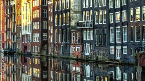 Amsterdam City Scene, typical dutch houses and their reflection in the canal.