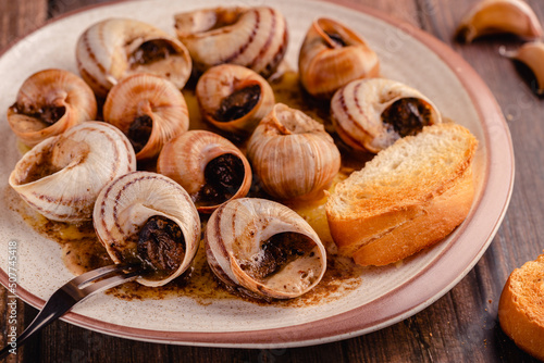 snails with butter on a plate
